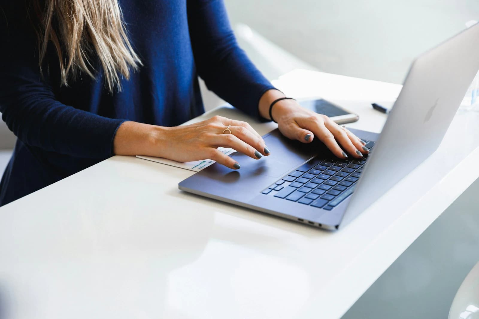 Person typing on a MacBook Pro