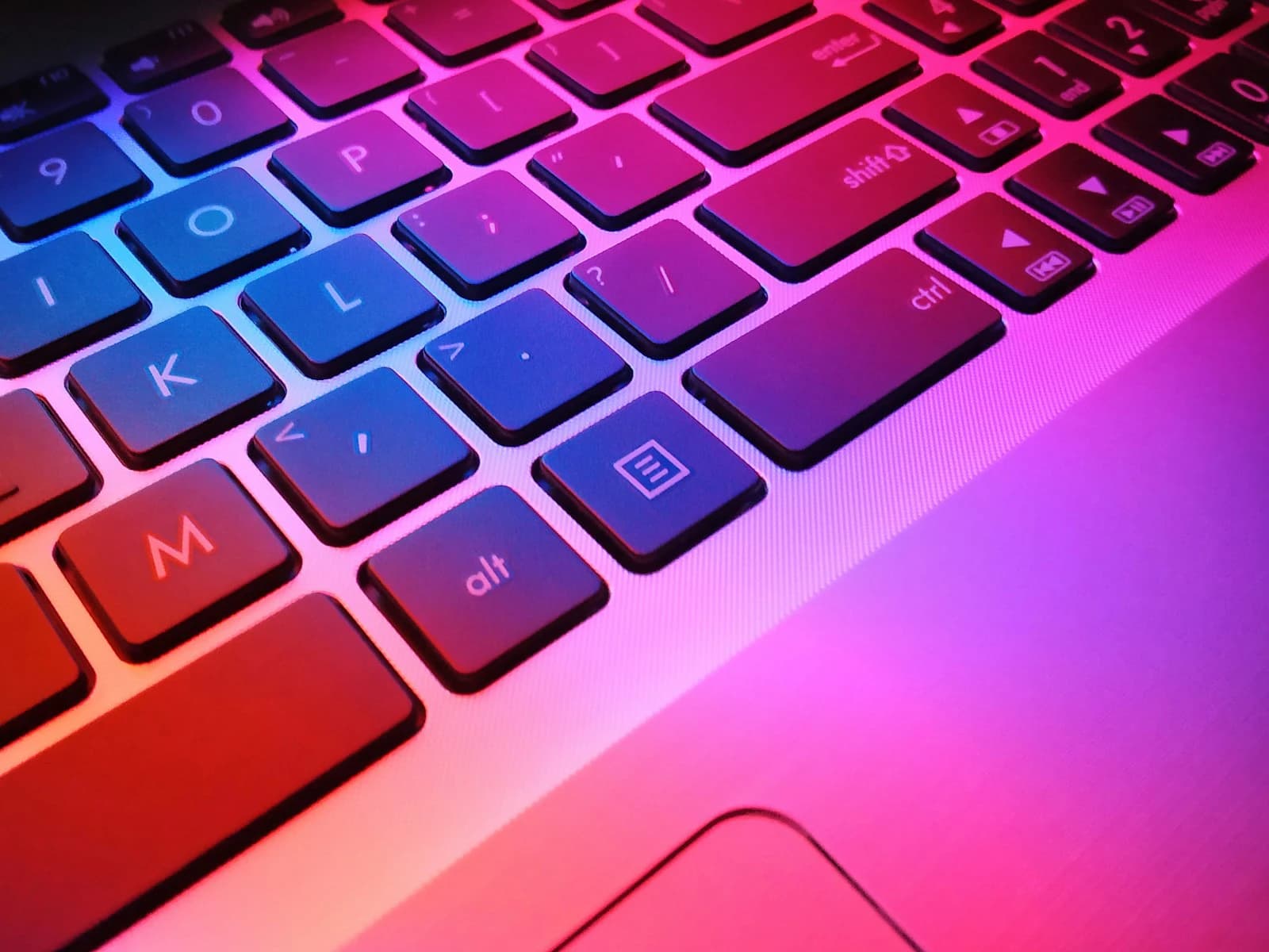 Close-up of a laptop keyboard with colourful keys