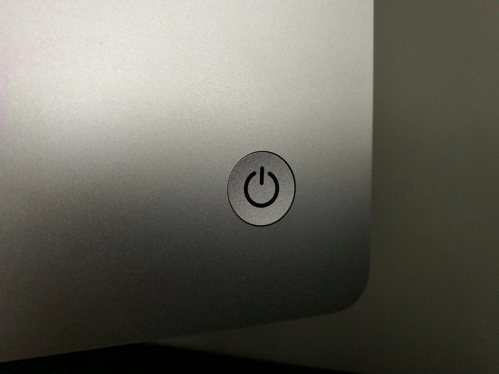 Power button on a silver iMac