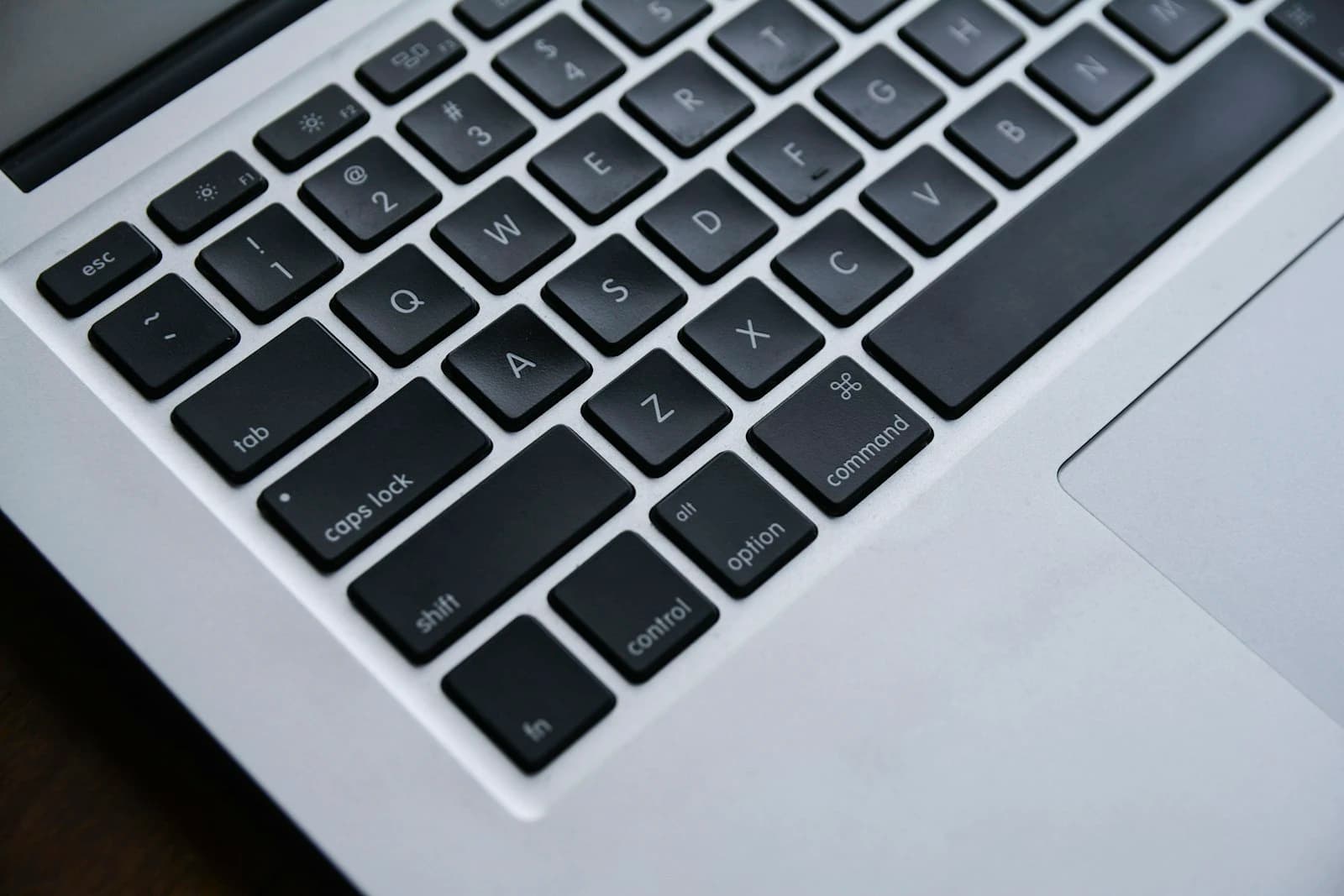 Close-up of the Command key on a laptop keyboard